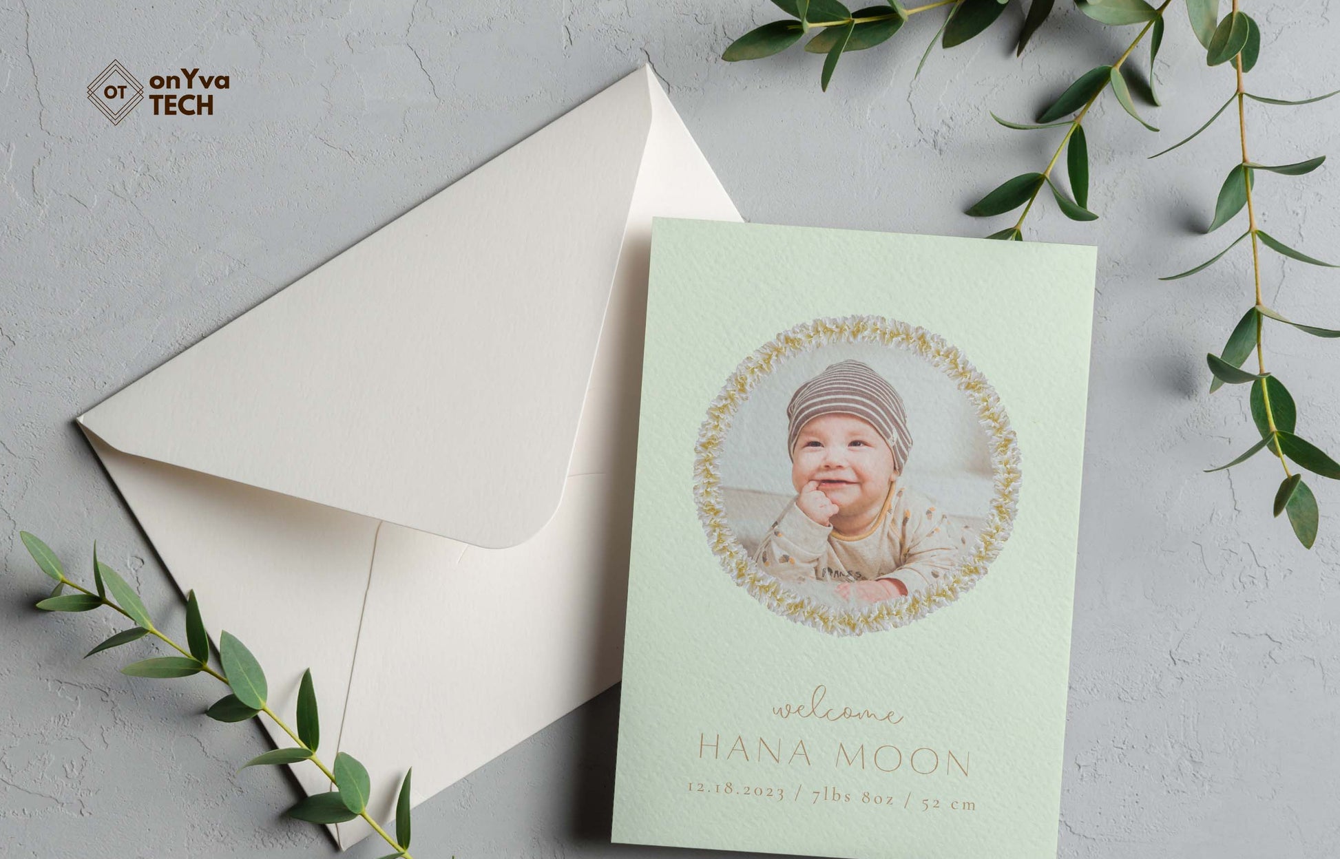  baby announcement card with a circle frame of   White Ginger Lei necklace around the picture. 